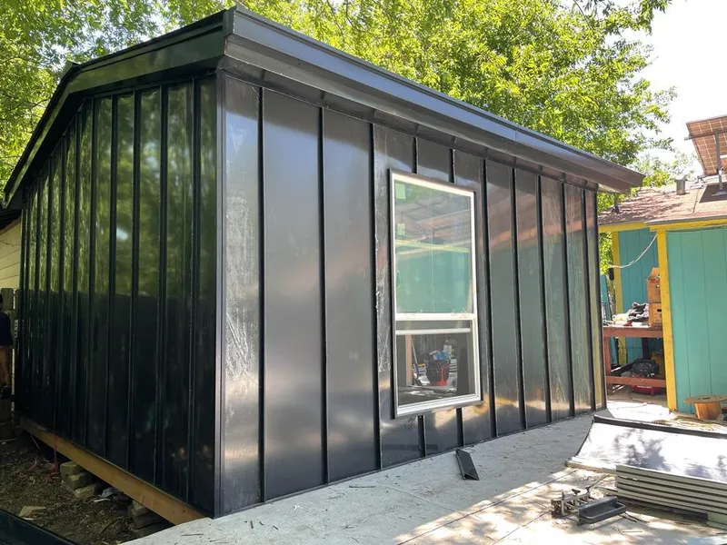 Black standing seam metal wall panels for Metal Roof Installation in Jamestown